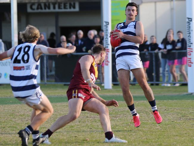 Luke Daniel takes a mark for Pearcedale against Tyabb on Saturday. Picture: Doug Farr