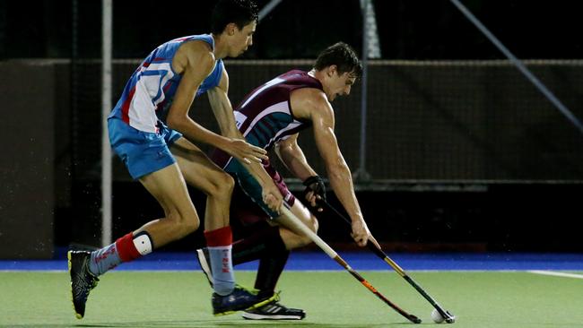 Cairns Hockey Association A-grade men’s match between Brothers and Saints. Saints’ Aden Conlan and Brothers’ Jacob Raymond. PICTURE: STEWART MCLEAN