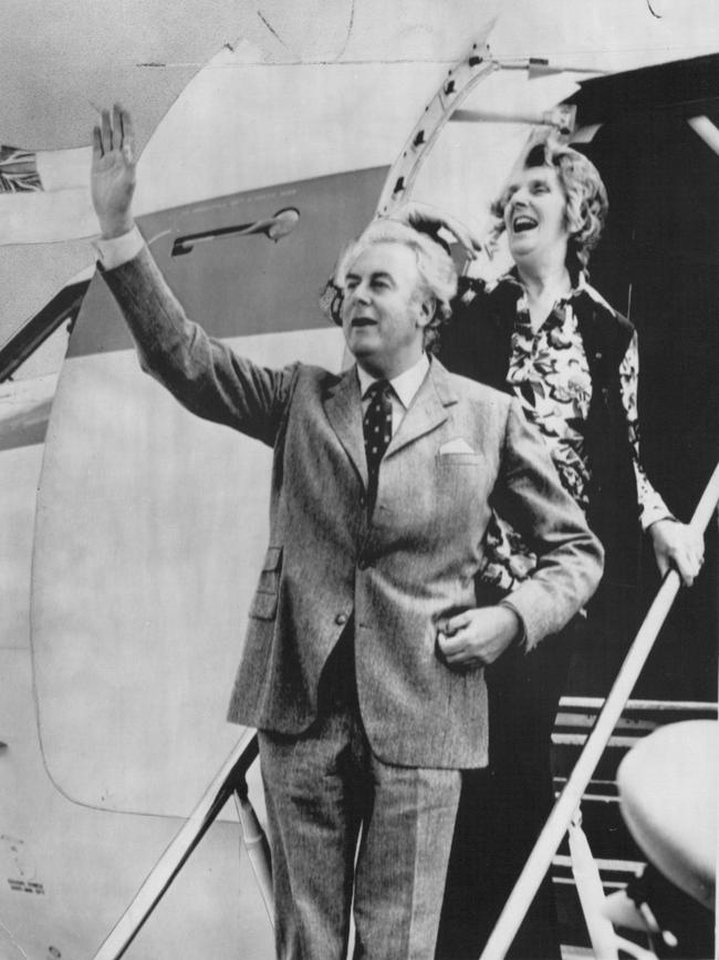 The PRIME Minister-elect, Mr Gough Whitlam, and his wife, Margaret, acknowledge a tumultuous welcome as they step from their VIP jet in Canberra yesterday. Pic Ray Strange