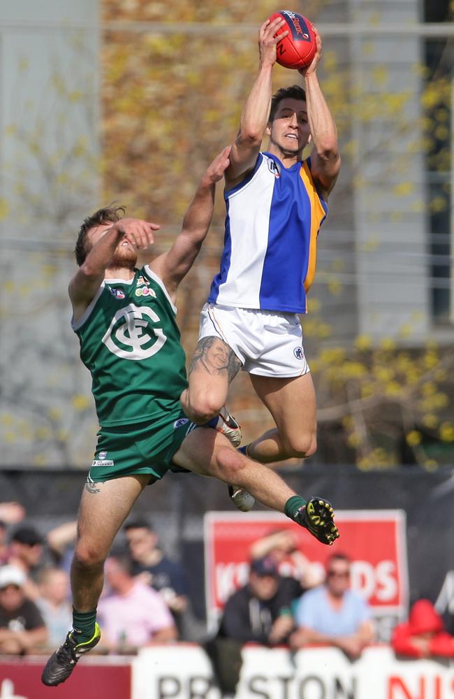 Joel Kidd rises high to take a big grab during the 2015 NFL grand final. Picture: Hamish Blair.