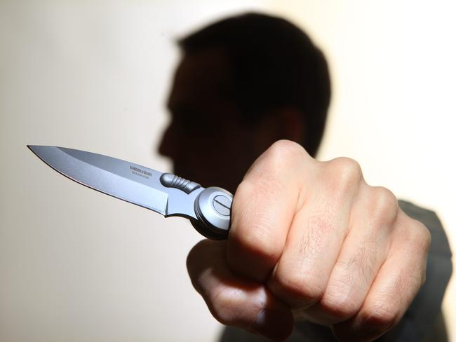 Generic image of a knife-wielding lunatic. Stabbing. Stabbed. Crime. Knife crime. Knives. Man.