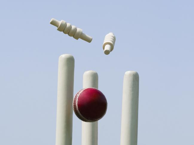 Cricket ball hitting stumps