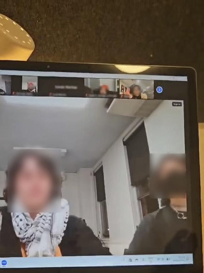 An ANU student (right) appears to perform a Nazi salute at a student association meeting during a discussion about the pro-Palestine encampment. Picture: Supplied