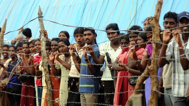 Internally displaced ethnic Tamils at the Manik Farm refugee camp, in Vavuniya, Sri Lanka in  2009.  (AP Photo/Lakruwan Wanniarachchi, Pool)