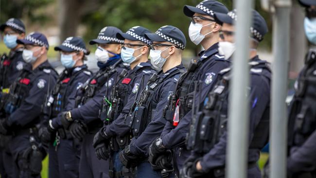 Scenes of surrounding police at the Flemington public housing towers conjure comparisons with China’s handling of the pandemic. Pictures: Tim Carrafa