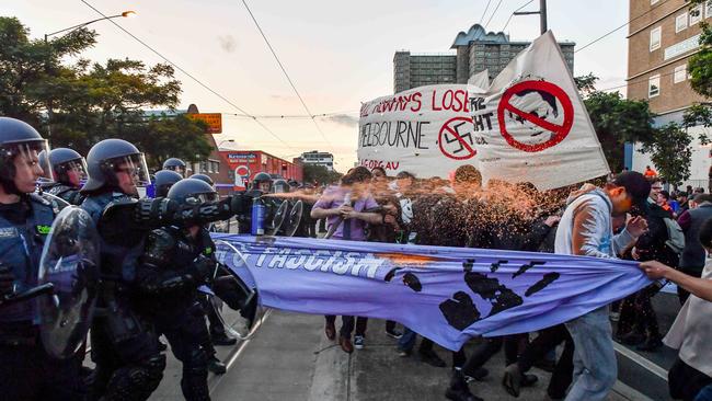 Police use pepper spray to disperse protesters outside Milo Yiannopoulos’s Melbourne venue. Picture: Jake Nowakowski