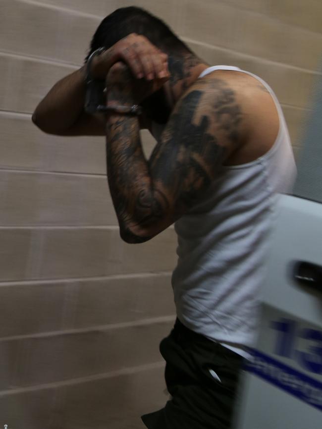 The man arrives at Auburn police station.