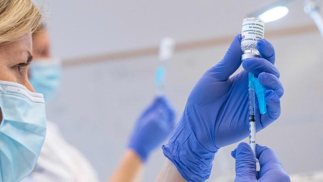 Syringes are loaded with the AstraZeneca Covid-19 Vaccine at the Skane University Hospital vaccination centre in Malmo, Sweden, on February 17, 2021. (Photo by Johan NILSSON / TT NEWS AGENCY / AFP) / Sweden OUT