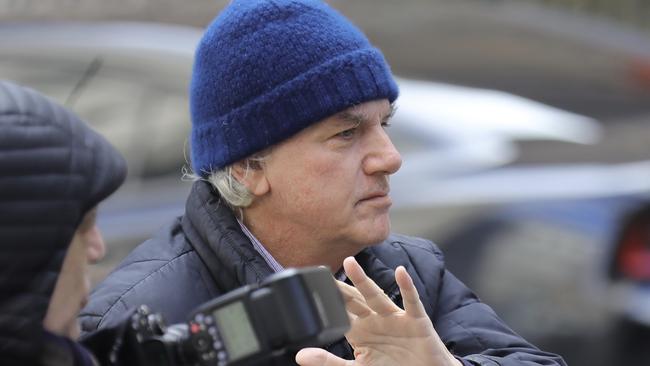 Gregory Abbott, founder and chairman of International Dispensing Corporation, leaves after appearing in federal court in New York. Photo: AP Photo/Bebeto Matthews.