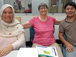 PROUD ACHIEVERS: English tutor Joy Williamson with Katima Ahmadi and her son Mohammad Hossain. Picture: contributed