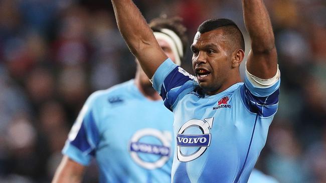 SYDNEY, AUSTRALIA - MAY 03: Kurtley Beale of the Waratahs celebrates a try by team mate Dave Dennis during the round 12 Super Rugby match between the Waratahs and the Hurricanes at Allianz Stadium on May 3, 2014 in Sydney, Australia. (Photo by Mark Metcalfe/Getty Images)