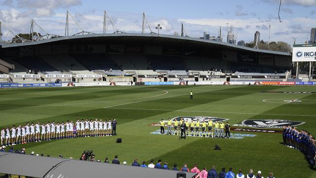 Oakleigh and Eastern Rangers stand for the national anthem before the NAB League Grand Final in 2019, 2019. Picture: Andy Brownbill