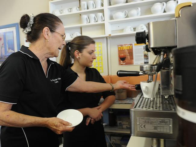 From left to right: Pam Manzi, owner of La Piccola Villa Cafe in Penrith, trains work experience student, Faith Alanson, 17 year old Year 12 student at Wycliffe Christian School in Warrimoo.