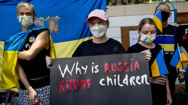 Protesters outside the Russian embassy in Bangkok on Wednesday in demonstrating against Russia’s invasion of Ukraine and the deaths of children in Mariupol. Picture: Jack Taylor/ AFP