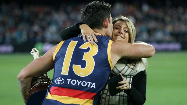 Walker hugs Walsh’s daughter Quinn after the Showdown in 2015. Picture: Calum Robertson.