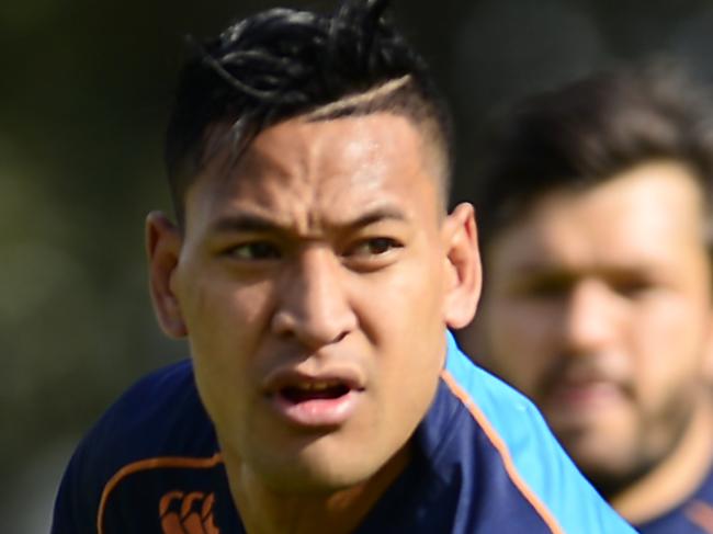 SYDNEY, AUSTRALIA - JULY 24: Israel Folau of the Waratahs runs with the ball during a Waratahs Super Rugby training session at Kippax Lake on July 24, 2014 in Sydney, Australia. (Photo by Brett Hemmings/Getty Images)