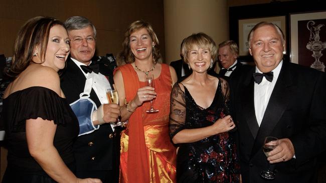 Ms Fewster, far-left, partying with her father, far right, and his second wife, Di Bliss, in 2003.