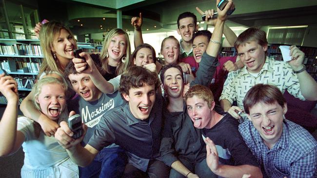 Students from Camberwell High School celebrate their VCE results, Ben Dyer (centre) who scored 99.9 celebrates with his fellow students.