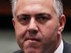 CANBERRA, AUSTRALIA - MAY 15: Treasurer Joe Hockey arrives to hear opposition leader Bill Shorten deliver his budget reply speech on May 15, 2014 in Canberra, Australia. The opposition leader stated Labor would not support some of the governments key budget measures including the fuel excise, raise in pension age and charges for visits to the GP. (Photo by Stefan Postles/Getty Images)