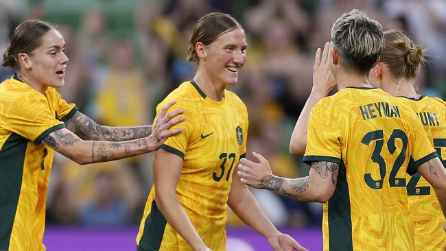 Tash Prior (centre) celebrates with teammates after scoring her first goal for the Matildas with a header against Chinese Taipei on Wednesday night. Picture: Daniel Pockett / Getty Images