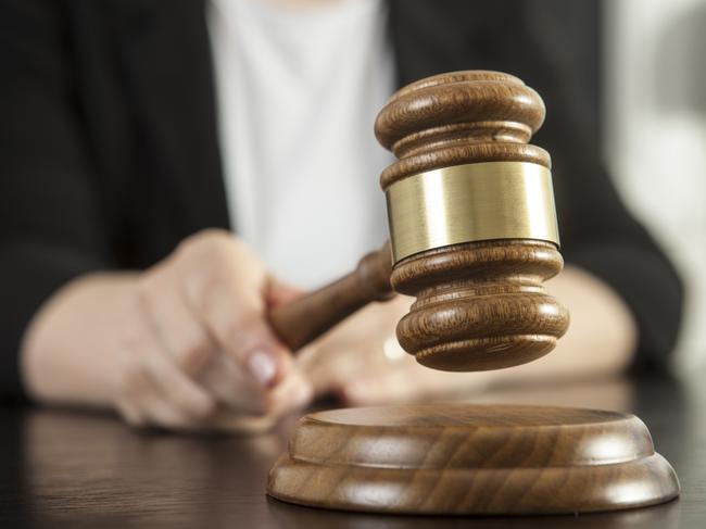 Caucasian woman holding gavel