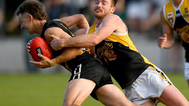 Jake Aarts of the Tigers is tackled by Brenton Lambert of the Stonecats during the 2023 MPFNL Division One Seniors Grand Final match between Dromana and Frankston YCW at Frankston Park in Frankston, Victoria on September 17, 2023. (Photo by Josh Chadwick)