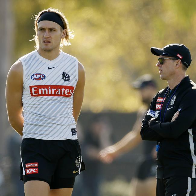 AFLPA president Darcy Moore (left) is open to shorter quarters, but having canvassed the playing cohort, he says the majority want no change to the duration of games. Picture: Michael Klein