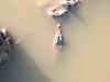 Children overboard: Nine people capsize in ‘croc central’