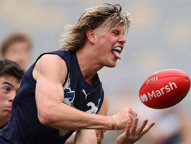 PERTH, AUSTRALIA - JUNE 23: Josh Smillie of Victoria Metro handballs during the Marsh AFL National Championships match between U18 Boys Western Australia and Victoria Metro at Optus Stadium on June 23, 2024 in Perth, Australia. (Photo by Paul Kane/AFL Photos/via Getty Images) *** BESTPIX ***