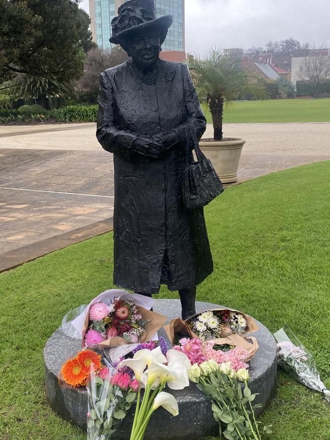 A growing mound of floral tributes at the Queen's statue at Government House in Adelaide. Picture: Dixie Sulda