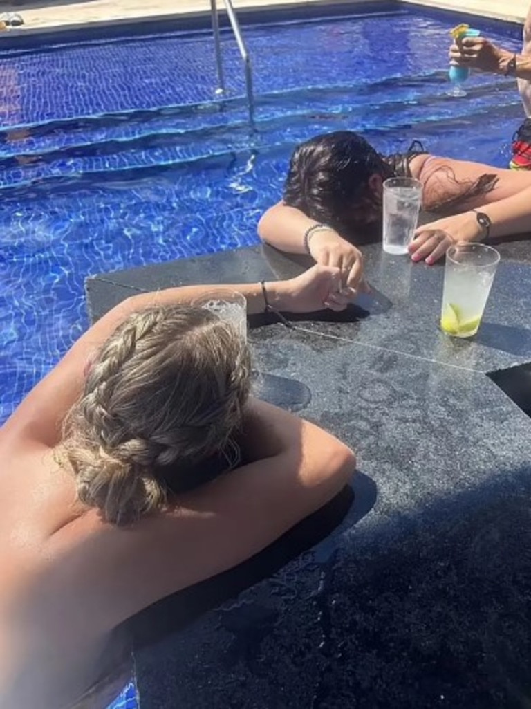 Horrifying photo shows Zara Hull and Kaylie Pitze with their heads on the bar after drinking waters they believe were drugged. Picture: Facebook / Rilee Works