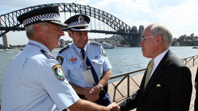 APEC 2007 – Ex Prime Minister John Howard shakes hands with Inspector Frank Gilroy. Picture: Graham Crouch