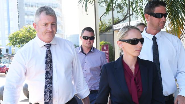 Senior Constable Deanna Mason (middle) leaves Darwin Local Court with her lawyer, Ray Murphy (left) and supporters after pleading not guilty to aggravated assault.