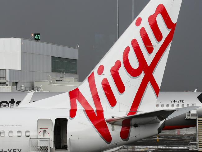 SYDNEY, AUSTRALIA - NewsWire Photos JUNE 28, 2021: Virgin and Jetstar Planes seen at Domestic Airport Terminal during the current Covid-19 Lockdown, Sydney Australia. Picture: NCA NewsWire / Gaye Gerard