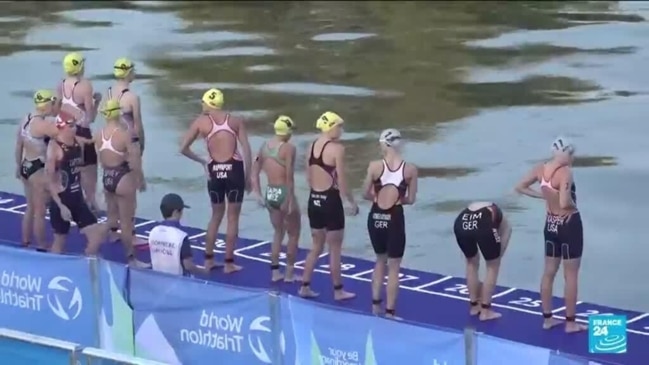 ‘What a special place to be in’: Triathletes swim in the Seine ahead of Paris Olympics