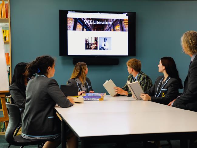 Albert Park College students watching a video presentation... The school has a number of programs in place to ensure students don’t fall through cracks in the system.