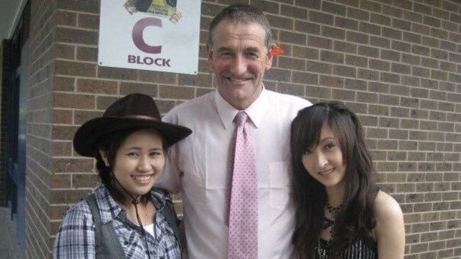 Mrs Locco’s husband, Frank Locco, with students at Chandler Secondary College in Keysborough. Photo: Facebook/JenJen Ly