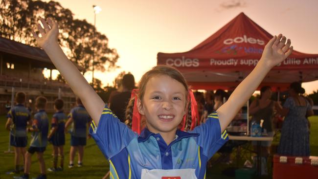 Matilda Steer, 7, celebrates a win for her sprint.