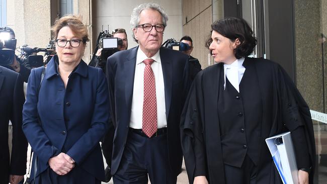 Geoffrey Rush (centre) arrives at the court. Picture: Dylan Coker