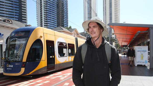 Josh Akehurst from Broadbeach Waters gets off at the light rail station in Surfers Paradise. Picture: Glenn Hampson