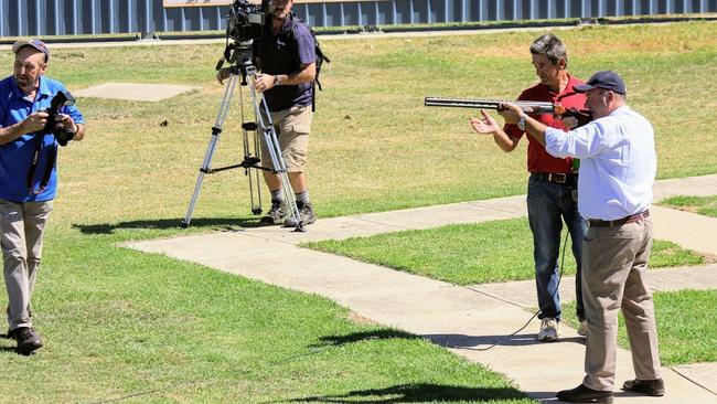 Maguire (holding the gun) at the International Clay Target Association world championships in Wagga Wagga, NSW, 2018. Picture: W.H.W Luckhoff