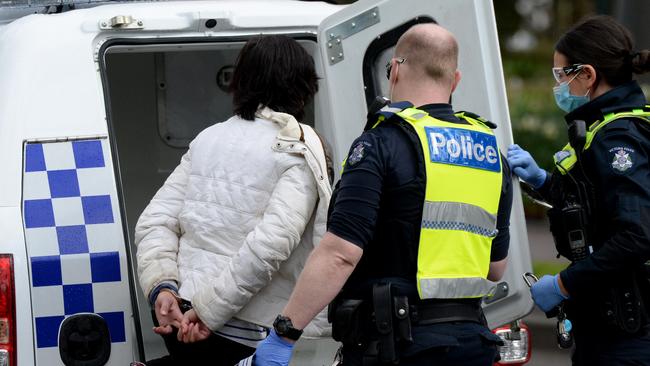 Police arrest a group of people gathered at the Janet Lady Clarke Rotunda in the Queen Victoria Gardens off Linlithgow Ave for breaching coronavirus restrictions. Picture: Andrew Henshaw