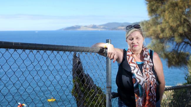 Blackmans Bay resident Helena Blundell would like to see alterations to the site that increased safety and warned people of the risks of going near the cliffs. Picture: LUKE BOWDEN