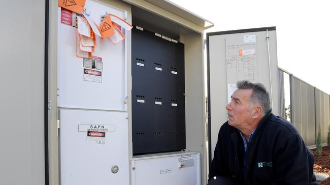 Construction manager Rod Kevern with smart meters at homes in Blair Athol, near Adelaide. Picture: Tracey Nearmy