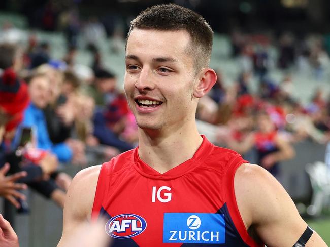 MELBOURNE, AUSTRALIA - JUNE 22: Kynan Brown of the Demons high fives fans after winning the round 15 AFL match between Melbourne Demons and North Melbourne Kangaroos at Melbourne Cricket Ground, on June 22, 2024, in Melbourne, Australia. (Photo by Quinn Rooney/Getty Images)