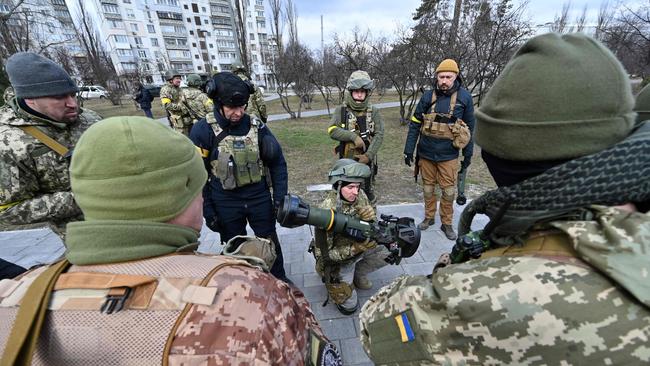 Members of the Ukrainian Territorial Defence Forces inspect new weapons, including NLAW anti-tank systems and other portable anti-tank grenade launchers, in Kyiv. Picture: AFP