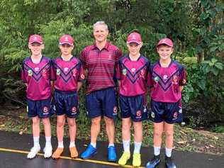 STATE REPS: Playing key roles in the Queensland under-12 boys' touch football team's successes at the national championships are (from left) Bailey Deakin, Sam Sheppard, coach Al Aston, Mitch Dabin and Kaden Willmot. Picture: Contributed