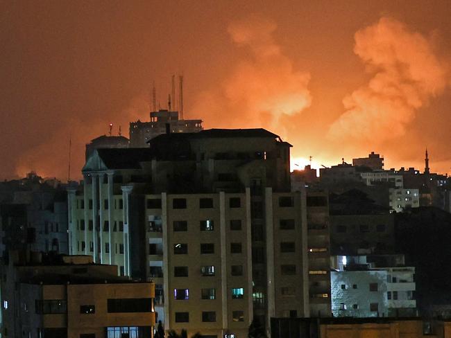 An explosion lights the sky following an Israeli air strike on Beit Lahia in the northern Gaza Strip. Picture: Mohammed Abed / AFP