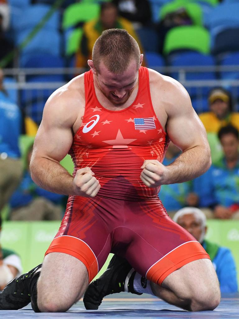 Kyle Frederick Snyder celebrates after winning against in Brazil. AFP PHOTO / Toshifumi KITAMURA