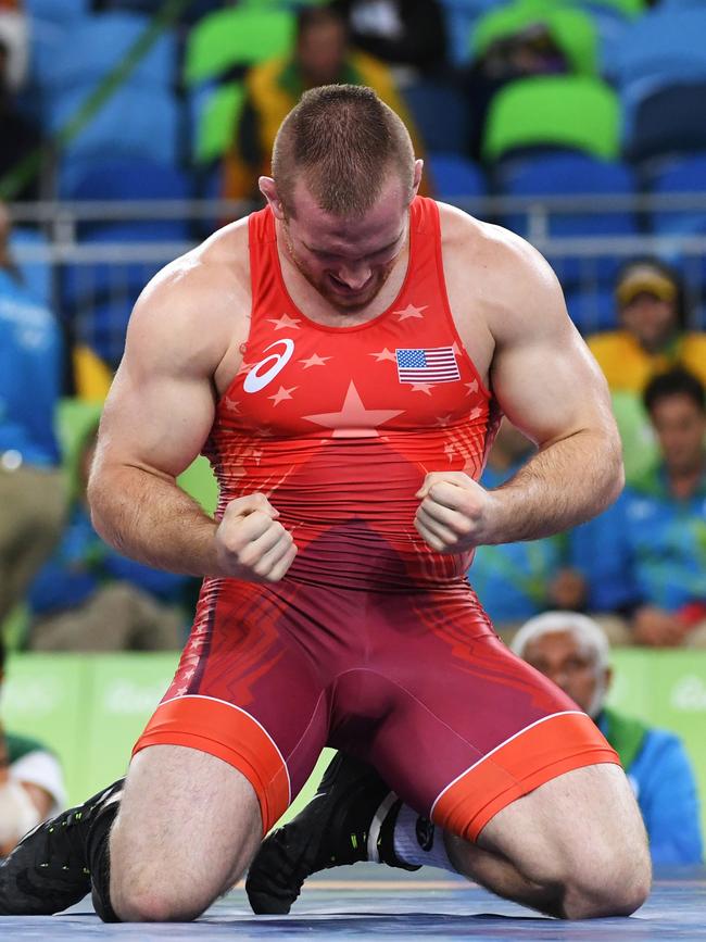 Kyle Frederick Snyder celebrates after winning against in Brazil. AFP PHOTO / Toshifumi KITAMURA